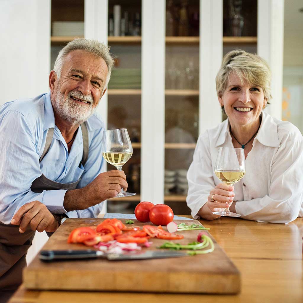 Older couple enjoying glass of wine together